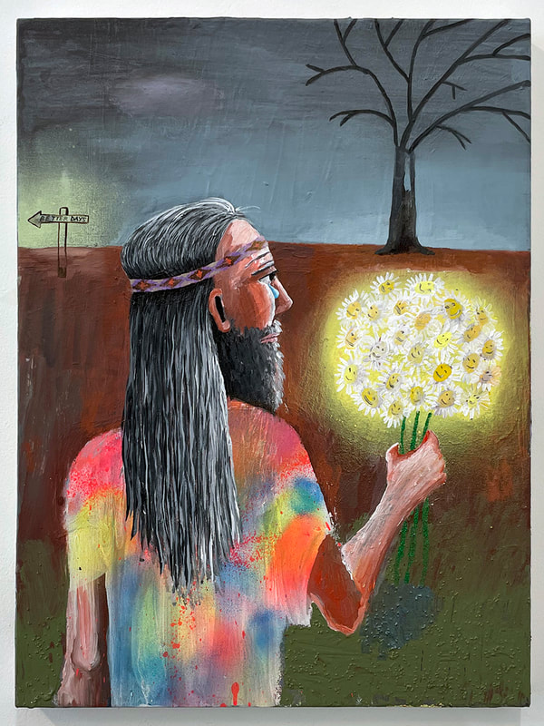 Man with a beard and long gray hair, wearing a headband and a tie dye shirt holds a bunch of daisies while gazing toward a dead tree in the distance