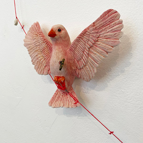 Ceramic pink canary with key and keyhole