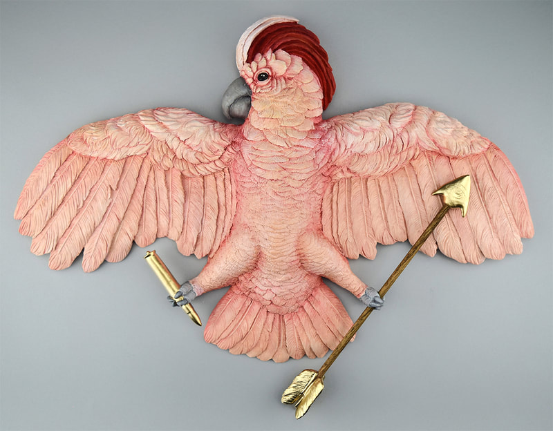 Sculpture of a Pink parrot with an arrow and bullet