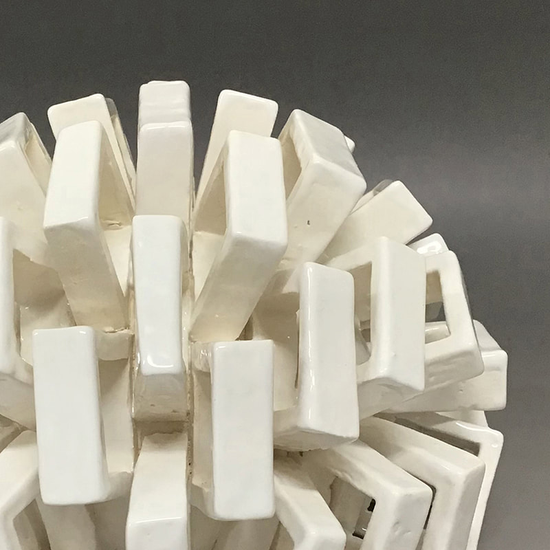 ceramic artwork with interlocking square elements