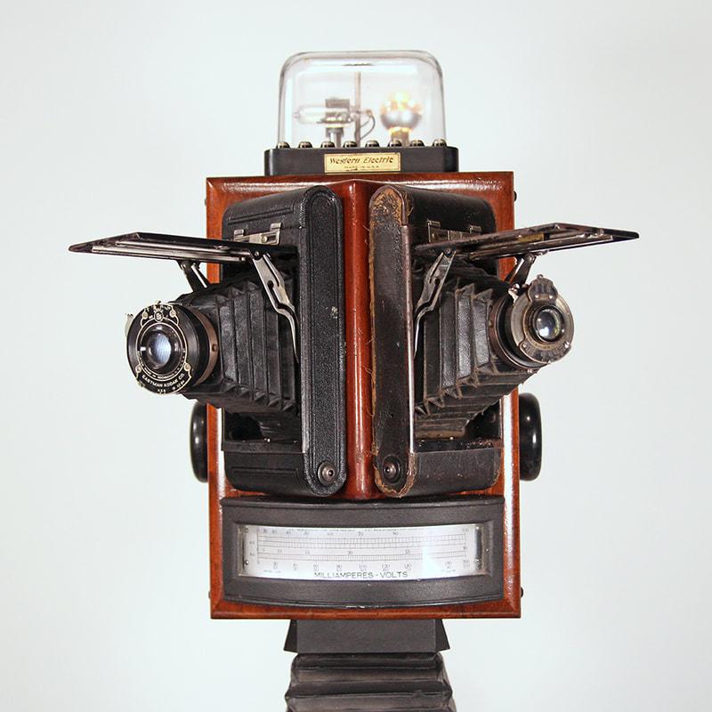 Sculptural head made of camera bellows and parts