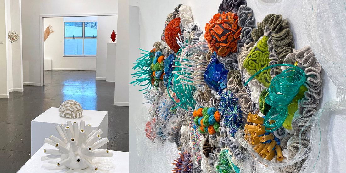 Art gallery with art on walls and pedestalsPicture