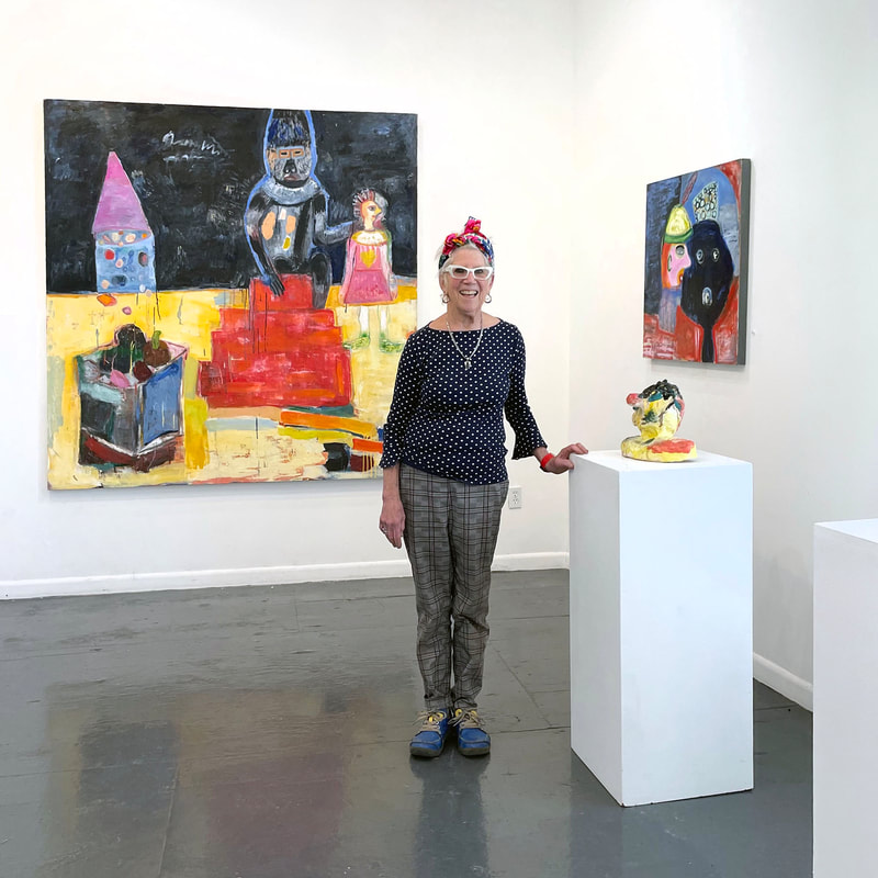 Livia Stein standing in art gallery