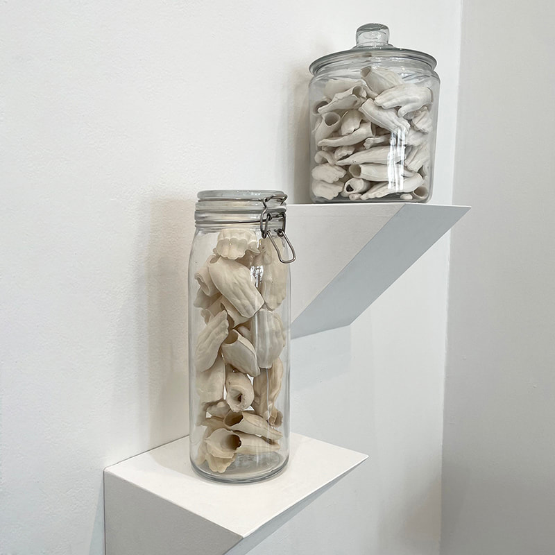 Ceramic hands in a jar