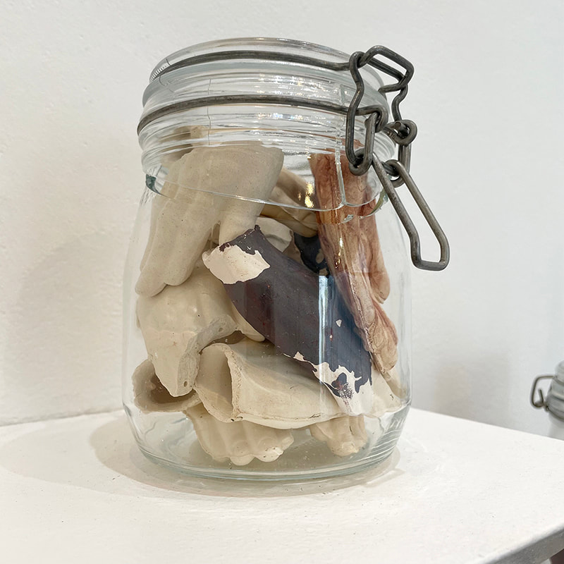 Ceramic hands in a jar