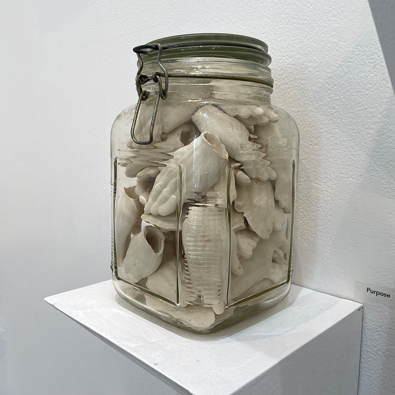 Ceramic hands in a jar