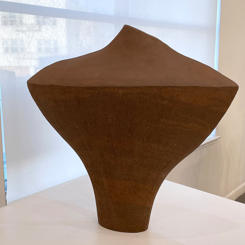 flattened shaped vase