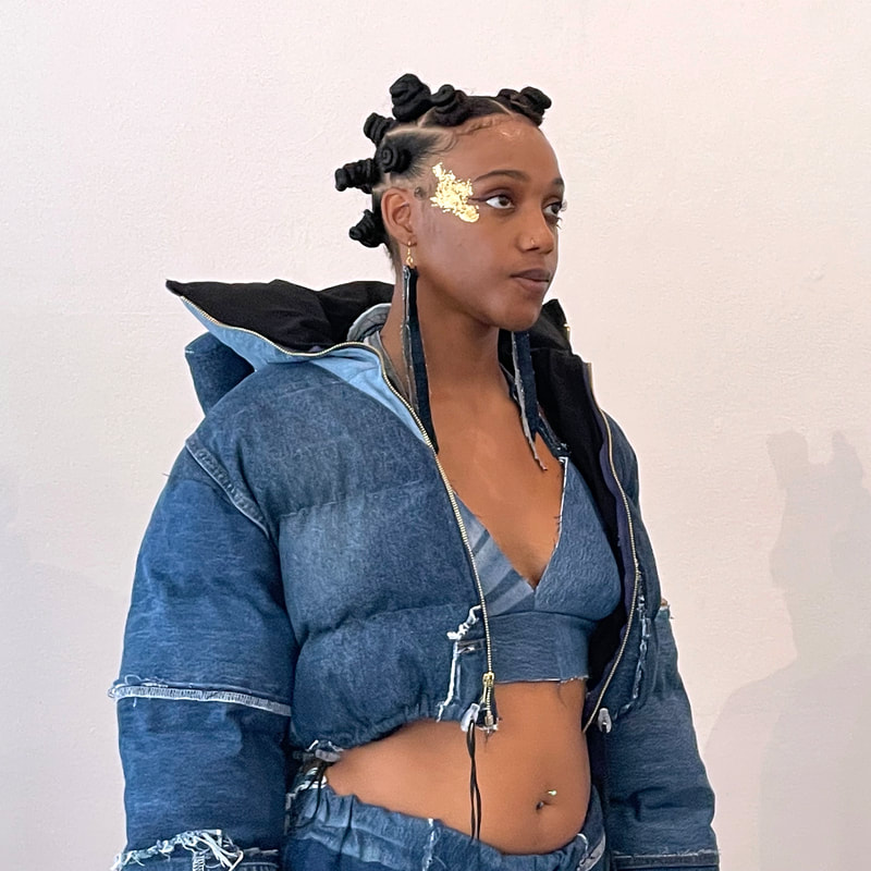 Model wearing a puffer jacket made from denim