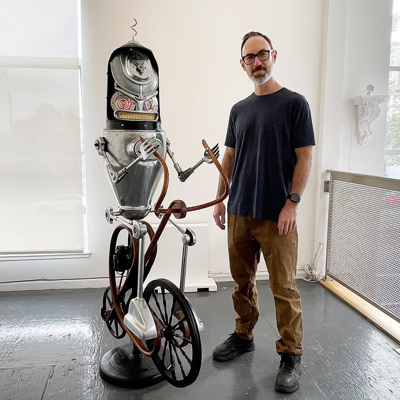 Robot sculpture with artist Nemo Gold