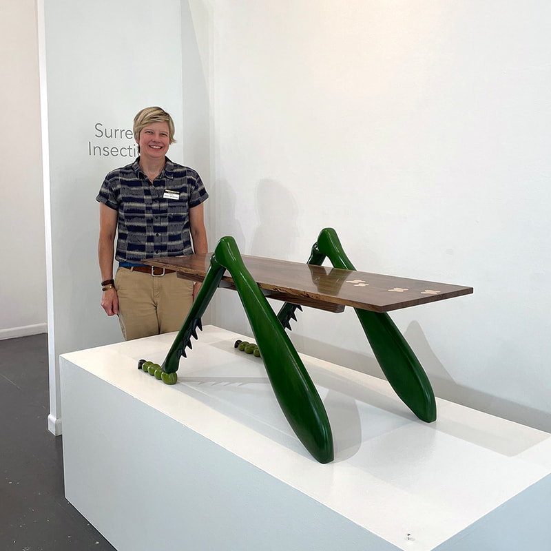 woman with coffee table that has grasshopper legs