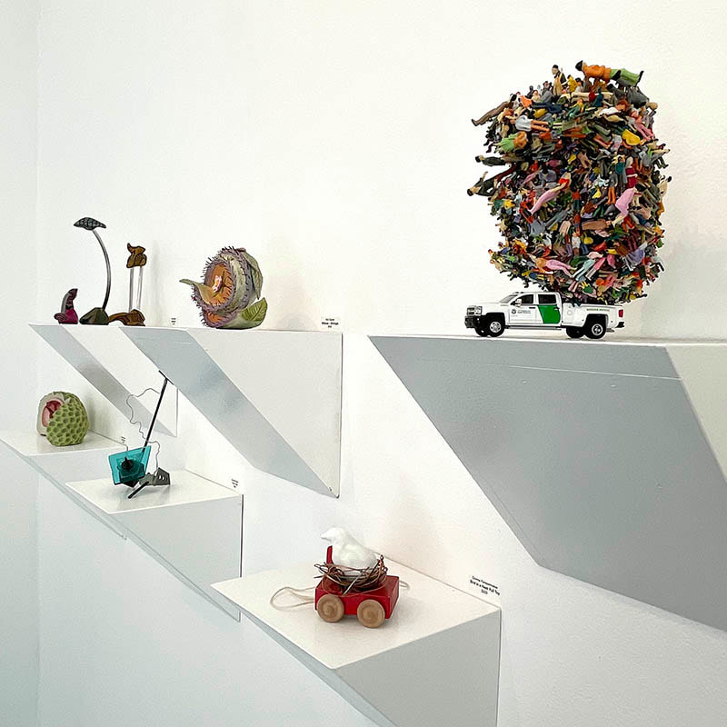 six small sculptures in a gallery