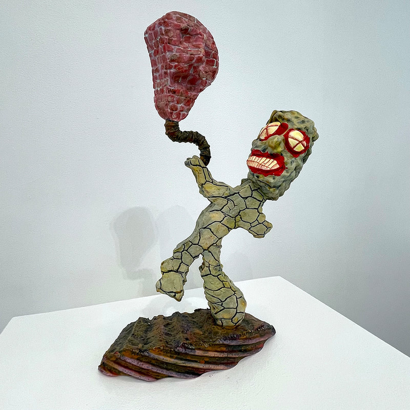 artwork of wobbly character with brick balloon