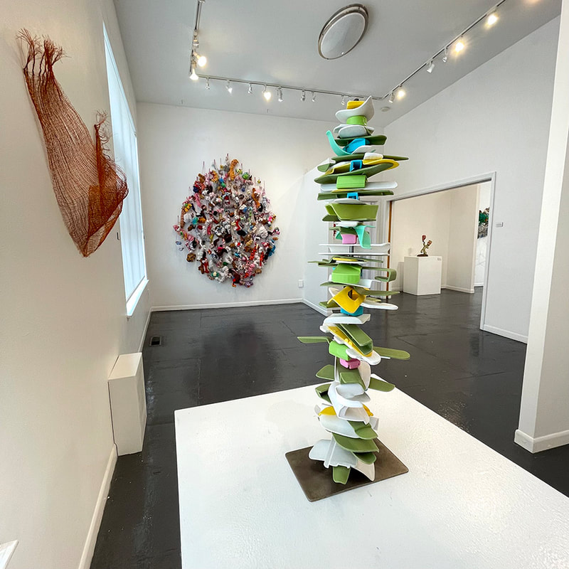 totem artwork of plastic pieces