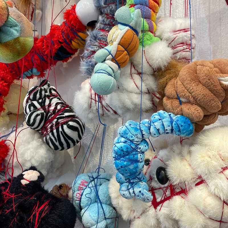 stuffed animals tied with string