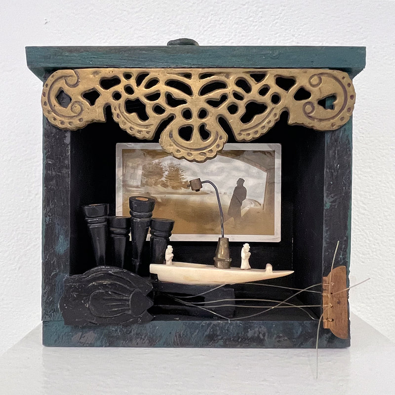 assemblage with boat, photo and filigree