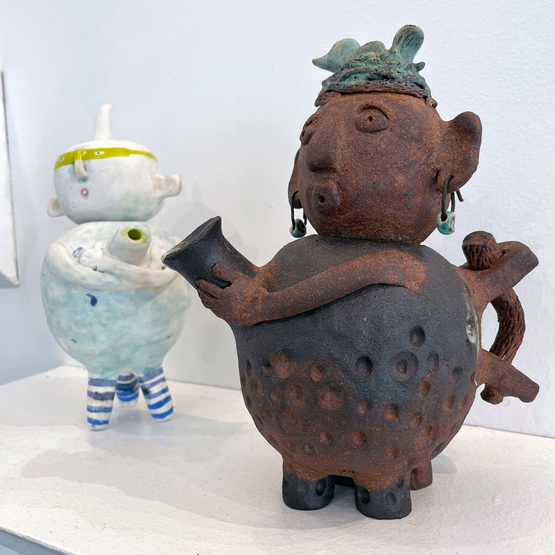 two human form teapots 