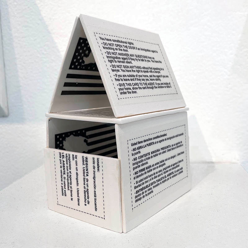 House built of porcelain cards listing right