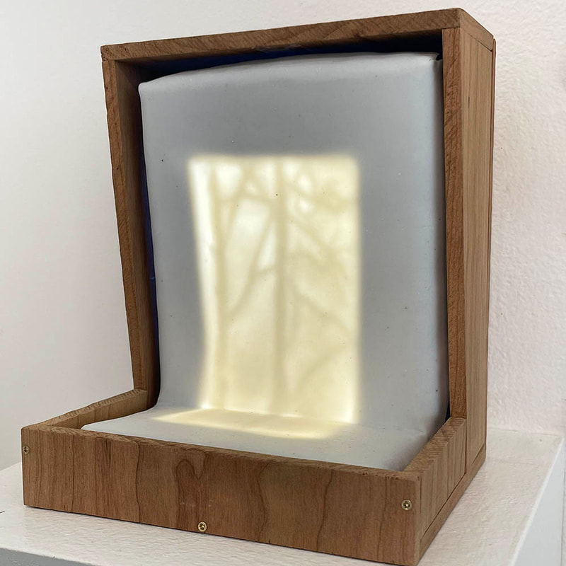 lighted ceramic panel with etching of tree branch
