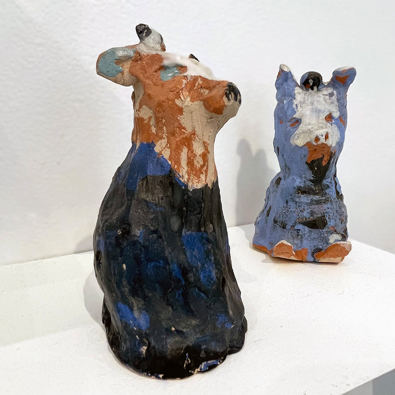 cow and dog sculpture