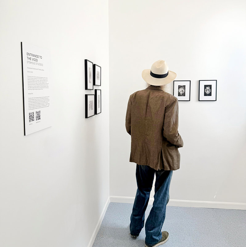 man looking at photographs